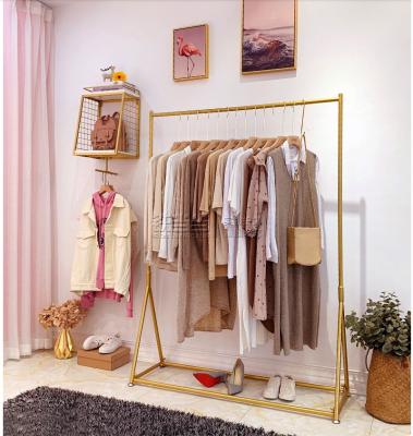 China Clothing Display Stand Gold Foldable Clothes Rack Metal Hanger for sale