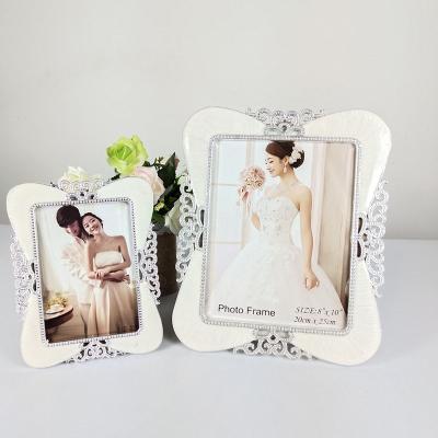 China Resin Luxury Rectangular Shape Resin Photo Frame For Home Table Decor for sale