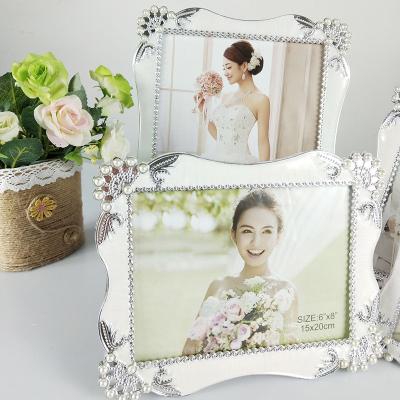 China Resin Wall Hanging Handicrafts Vintage Picture Resin Frame With Embossed Flower Design for sale