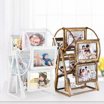 China Northern Europe Wholesale Creative White Windmill Frame Ornament Rotate Ferris Wheel Plastic Photo Frame for sale