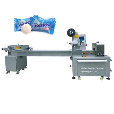 China 2022 Full Automatic Food Hard Candy Chocolate Balls Flow Packing Machine With Automatic Feeding for sale