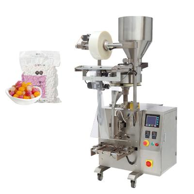 China Multi Function Automatic Small Vertical Pouch Granule Candy Snacks Pouch Packaging Food Filling Machine for sale