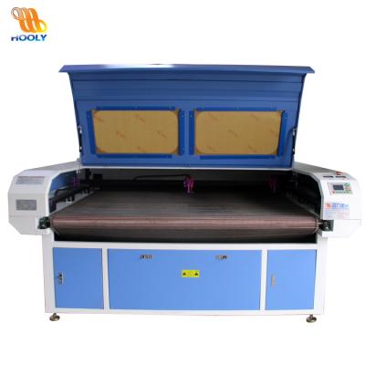 China New Automatic CO2 100w Feeding Fabrics Laser CUTTING 100w/Toys/Home Textile Cutting Machine/Fabric Laser for sale