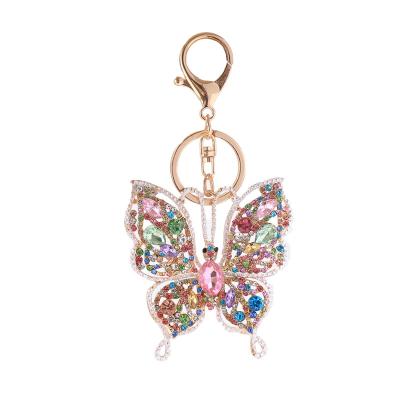 China Bag Car Pendant Accessories Wholesale Europe And United States Colorful Diamond Inlay Metal Keychain Creative Hollow Butterfly Key Chain Pendant As Gift for sale