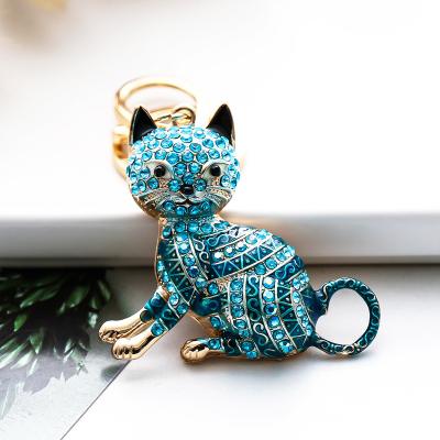 China Bag Car Pendant Accessories High Quality Europe And United States Fashion Cartoon Cat Keychain Colorful Diamond Inlay Hollow Metal Keychains for sale