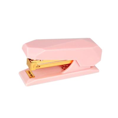 China Non-slip carpet & Beautiful Appearance Pink Spring Operated Cute Mini No-Jam Desktop Staplers Stapler With Gold Non-Slip Base Rod 20 Sheets Capacity for sale