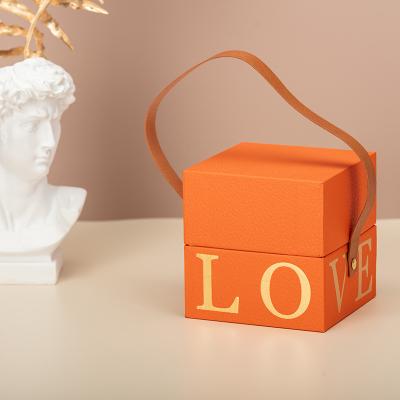 China Recycled Materials Luxury Orange Custom Telescope Boxes Small Handmade Textured Paper Box Square Cuff Box With Handle for sale