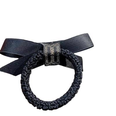 China European and American Korean Camellia Hair Tie Female Bow Soft Tie Pearl Style Rubber Hair Tie for sale