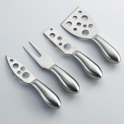 China Sustainable Smiling Face Kitchen Cheese Knife Set 4 Pieces Cheese Knife Stainless Steel With Hollow Handle for sale