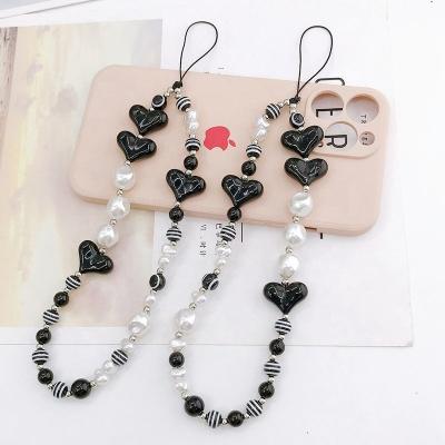 China Fashion New Trendy Fashion Black Beaded Phone Strap Lovers Wrist Phone Chain For Phone Accessories for sale