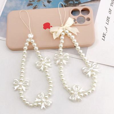 China Other Newest Fashion Bracelet Pearl Bowknot Pearl Wallet Keychain For Women Kid for sale