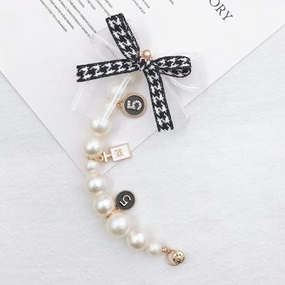 China Best Selling Fashion Trendy Bowknot Pearl Bracelet Beads Key Chain For Girls Women Handbag for sale