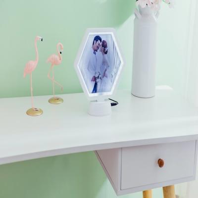 China Magic Creative Personalized Hexagonal Cosmetic Mirror Photo Frame Mirror With LED Lamp for sale