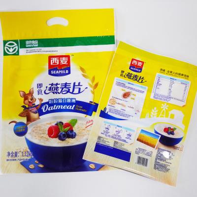 China Envases de alimentos con laminador de seguridad de gran tamaño 1.2 Kg 2.64lb Harina de avena con agujero de mano en venta