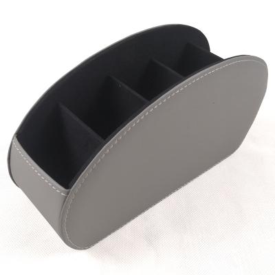 China Innovative Leather Remote Control Holder Storage Box Living Room Desktop Cell Phone TV Remote Control Holder for sale