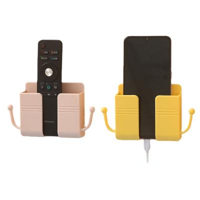 China Multi-functional punch-free mobile phone wall socket mobile phone remote control holder wall mounted remote control holder for sale