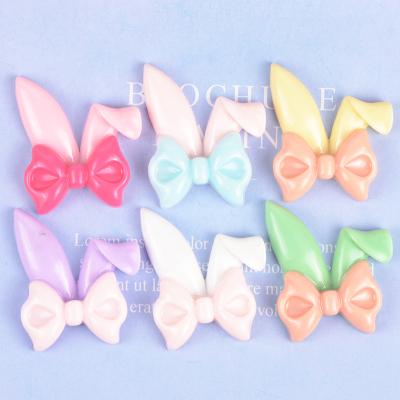 China 100Pcs/Bag Cute Europe Bow Tie Rabbit Ears Resin Flat Back Cabochon For Phone Shell Hair Bow Center Decoration Accessories for sale