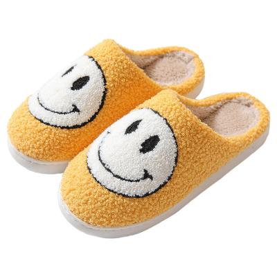 China Fashion trend cute fuzzy home slips smile face slipper ladies winter indoor flat warm house slippers for women for sale