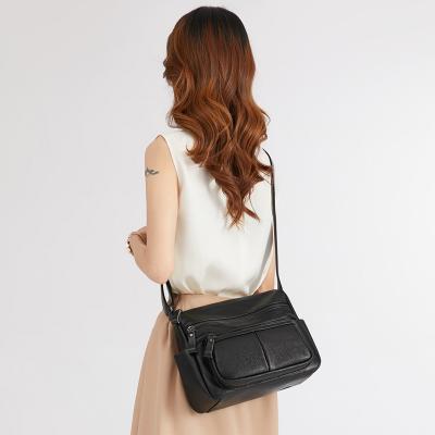 China Wholesale Fashion Women's Casual Black Cross Large - Body Bags Multi Pocket High Quality Ladies Soft Leather Bags for sale