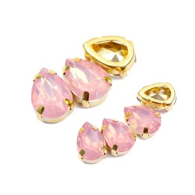 China Flatback Wholesale 7X10mm Water Drop Gold Claw Set Horse Eye Shape Color Resin Stones DIY Opal Resin Stones For Garment for sale