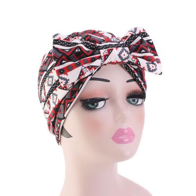 China New fashion fashion rose muslim turban hat flower turban hat long tail scarf muslim hijab hat for sale