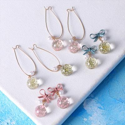 China Fashion wholesale two popular style dry flower stud earrings dangle long drop glass ball earrings for women for sale