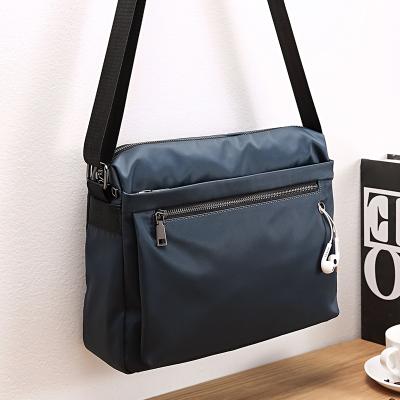 China China manufacturer nylon man bags with earphone hole boys throw shoulder side messenger cross - body bags for men 2021 for sale