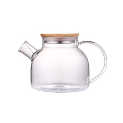 China Viable Wholesale Teapots Water Heat Resistant Glass Pitcher With Removable Lid And Wide Handle for sale