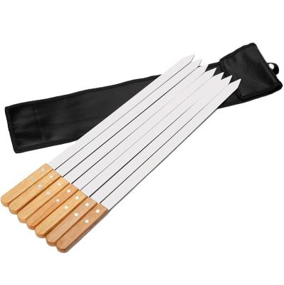 China Custom Easily Cleaned 23 Inch Stainless Steel BBQ Skewers With Wooden Handle Brazilian Spikes Flat Grilling Sticks Set Of 7 With Bag for sale