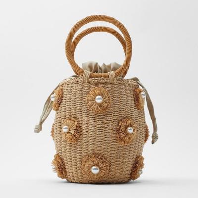 China Fashion Handbags 2022 New Arrival Beads Basket Woven Bags Straw Decorative Handmade Bags for sale