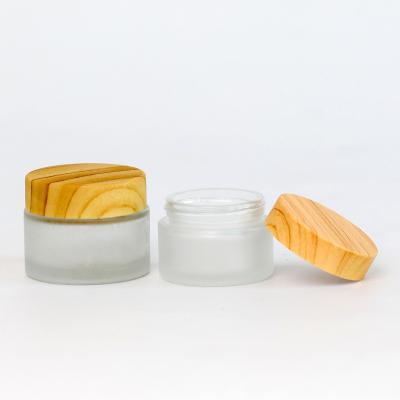 China Cosmetic in lid stock cosmetic bamboo glass jar cosmetic glass jar with bamboo lid, bamboo glass jar cosmetic for sale