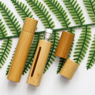 China Environmental Friendly In Stock Essential Oil Bottle Roller 5Ml Bamboo Glass Roller 10Ml Bottles With Bamboo Lid, Bamboo Perfume Bottle for sale