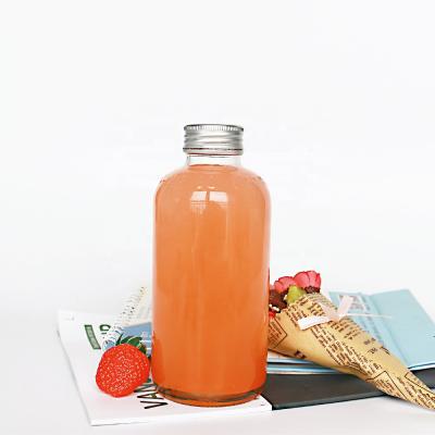 China Boston Classic 250ml Bottle Glass Round Juice Metal Screw Cap Clear Orange for sale