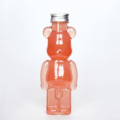 China 300ml Beverage Customized Bear Shape Disposable Juice Bottle PET Plastic Drinking Beverage Bottle for sale