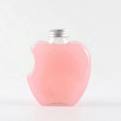 China Screw Cap Empty Apple Shaped Plastic Candy Bottle Unique Shaped Plastic Bottles for sale