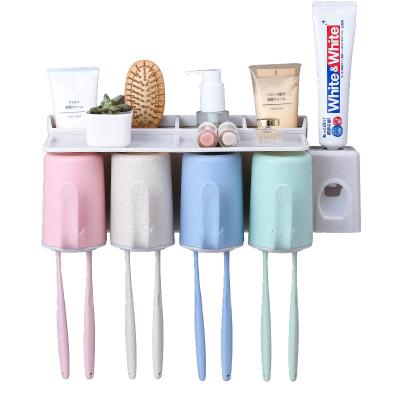 China Sustainable Automatic Automatic Toothpaste Dispenser Toothbrush Holder Set With Cup Wall Mount Holder for sale