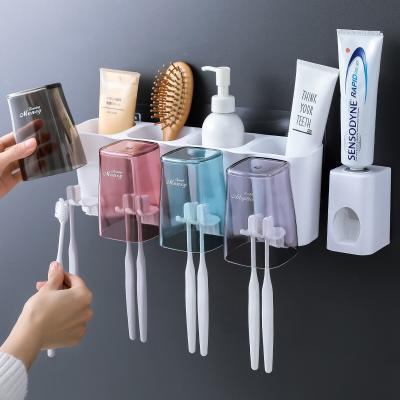 China Home Toothbrush Holder Viable Toothpaste Set Family Bathroom Wall Mount Holder Storage Rack With Toothpaste Dispenser for sale