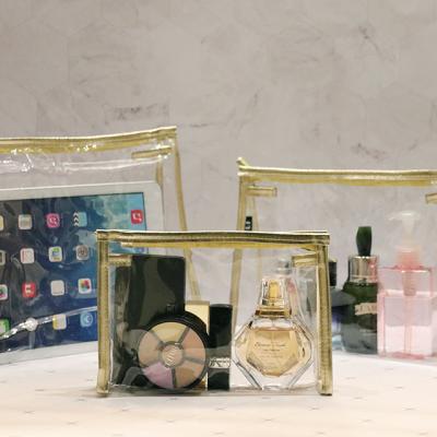 China Custom Fashoion Logo Gold Transparent Clear PVC Cosmetic Bag Binding Makeup Bags for sale