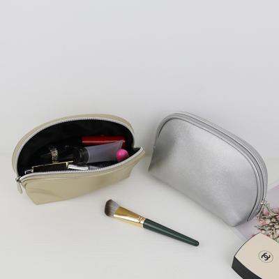 China Custom Logo Elegant Women Makeup Bag Solid Color PU Waterproof Cosmetic Bags Large Capacity for sale