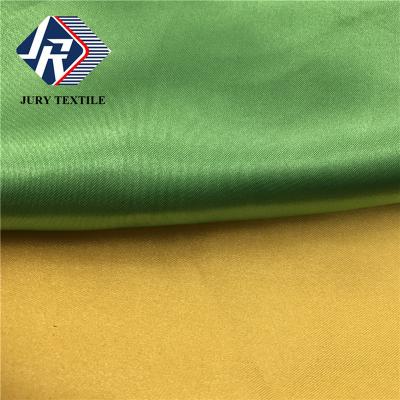 China 50D*75D Smooth Soft Luminous Spandex Polyester Spandex 100% Silk Satin Touch Fabric For Wedding Dress for sale