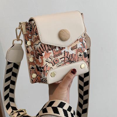 China 2021 PU Cross - Body Graffiti Purses Launch Bag Women Fashion Design PU Leather Messenger Bags for sale