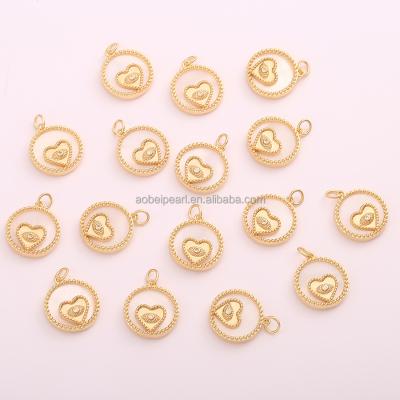 China Popular pendant made of 18K gold round zircon with a little love heart inlaid in the middle, DIY material, ETS-K624 for sale