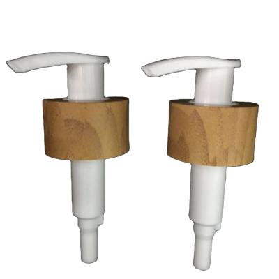 China Reverse non 28/410 advanced water transfer process thick ring to imitate pump wooden head bottle emulsion cosmetics lock switch left right pump for sale