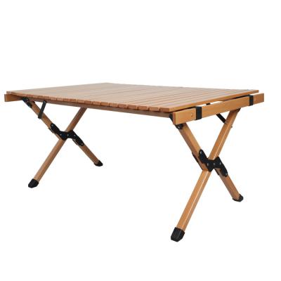 China Outdoor Foldable Portable Folding Table Easy Carry Beech Wood Egg Roll Table Camping Picnic for sale