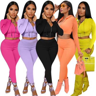 China 2021 Drop Breathable Two Piece Pants Set Solid Color 2 Piece Women Crop Top Fashion Bodycon Tracksuit Clothes Tracksuit Two Piece Set for sale