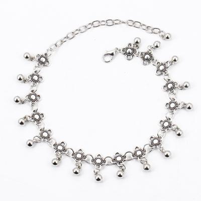 China Ethnic Fashion Trending Silver Hollow Carved Flower Beaded Foot Jewelry Anklets For Women for sale