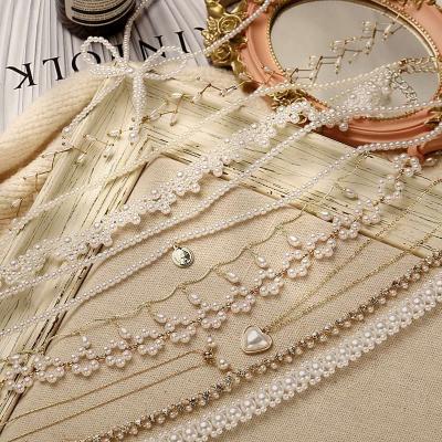 China Trendy Fashion Mixed Styles Charming Twist Braid Heart Flower Pearl Necklace Necklaces For Bride for sale