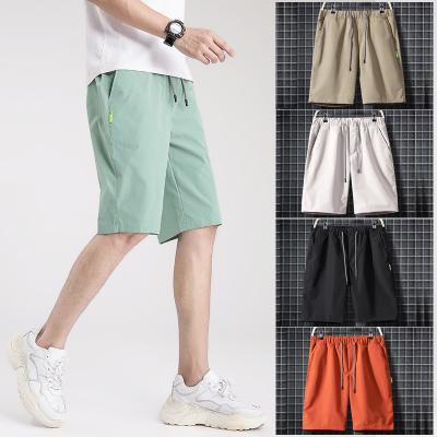 China Youth QUICK DRY Hot Selling Trend Shorts Men's Capris Solid Color Casual Pants 2022 Summer Sports Beach Pants Men for sale