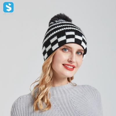 China COMMON Fashion Grid Wool Black And White Beanie Hats Fabric With Fur Pom For Women for sale