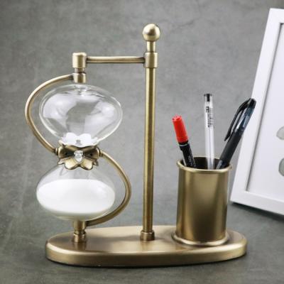 China Contemporary Hot Sale Crafts for Decoration Custom Brass Pen Holder Hourglass Sand Timer with Pen Container Sand Clock Metal Hourglass for sale